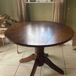 SOLID WOOD DINING TABLE - W/ ADJUSTABLE SIDES