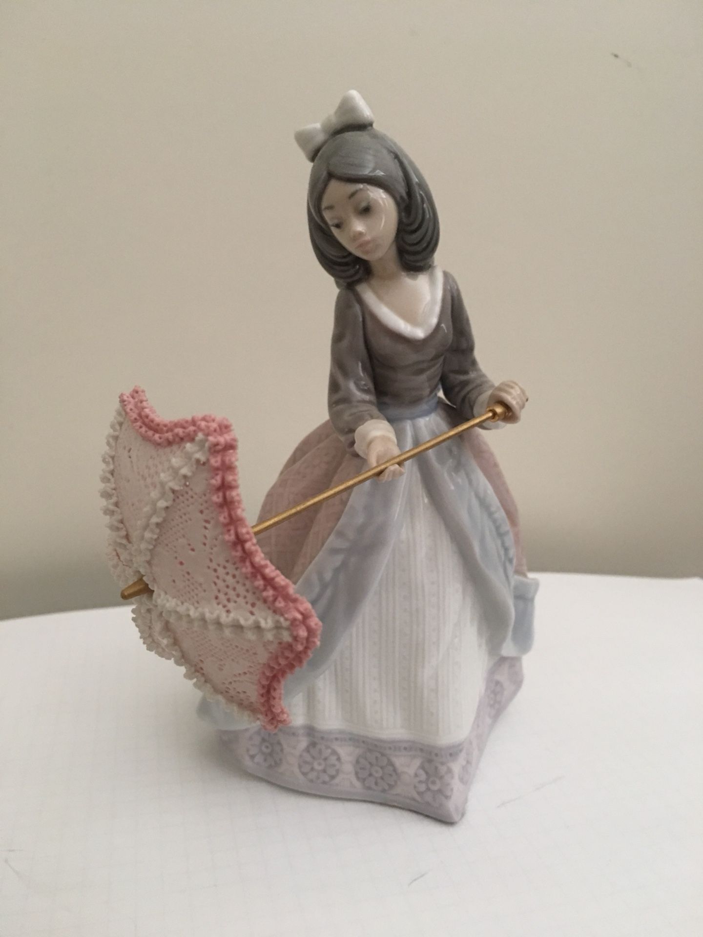 Lladro lady with umbrella porcelain figurine