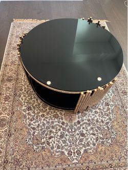 Two tiered glass top coffee table