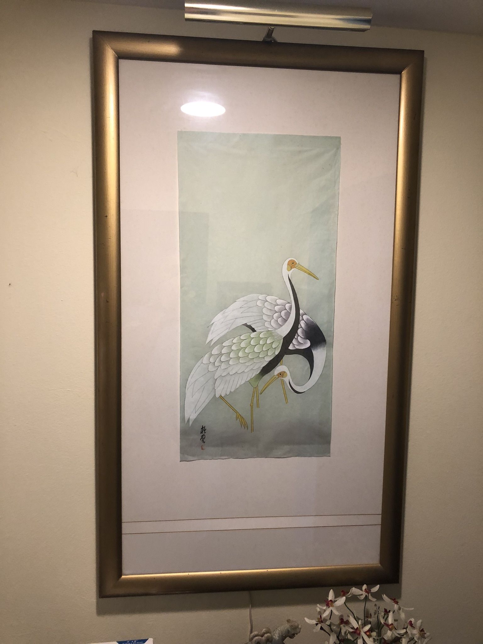 Framed Asian Crane Artwork with Light from above it.  