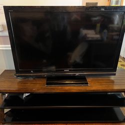 Sony 50inch TV with 70 inch Solid Wood/Glass Stand