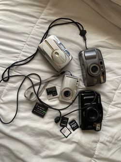 Bundle of 4 vintage cameras and accessories: