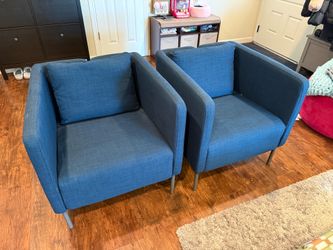Two IKEA Ekero arm chairs, dark blue