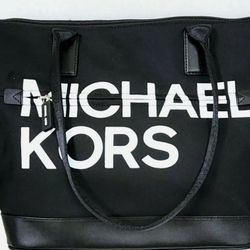 NEW OPEN BOX NEVER WORN. NEW MICHEAL KORS SPORT LOGO STYLE, BLACK LEATHER & NYLON TOTE BAG WITH LEATHER STRAPS & BOTTOM. O.b.o.  