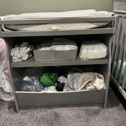 Delta children changing and storage table with brand new changing pad