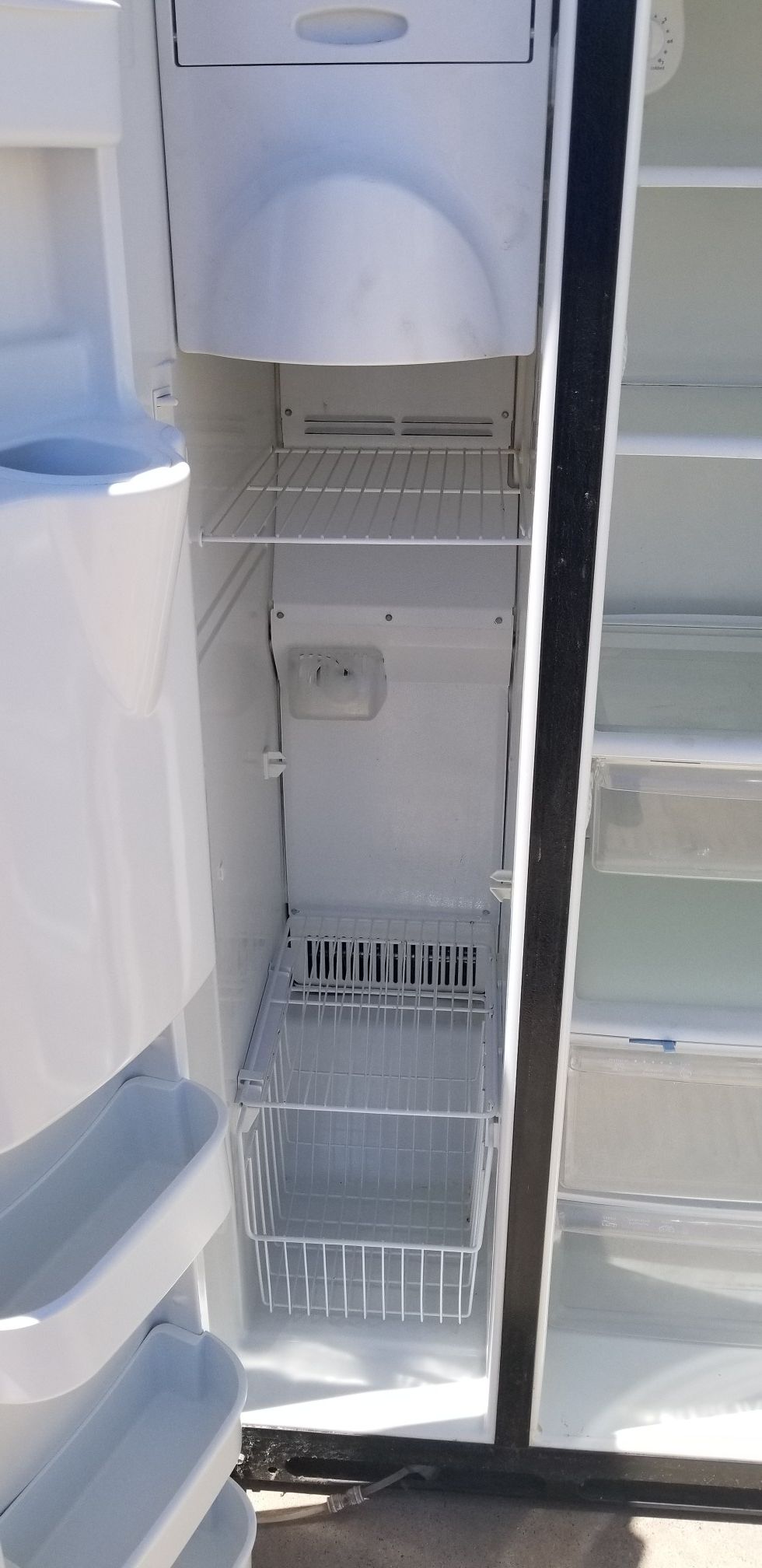 Black Amana fridge with Ice machine and filtered water dispenser for