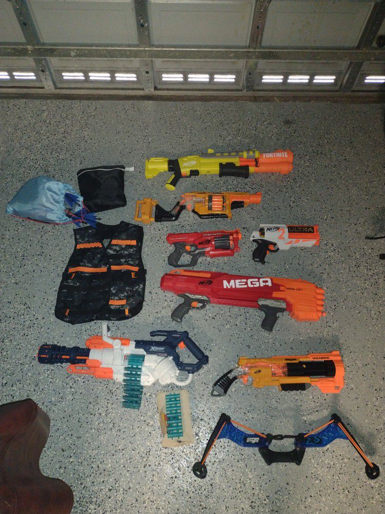 Multiple Nerf Guns, Including Various Accessories And Extra Darts