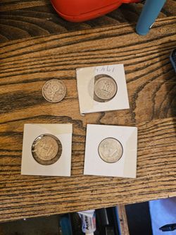 Silver quarters and an old Germany coin