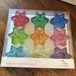 Two boxes of  bright star taper holders (9 per box)
