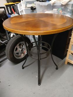 Beautiful Wodd n Rid Iron Table
3' round
3' 4" high