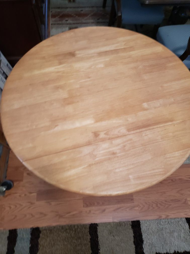 Round wood kitchen table with 4 wood chairs in good condition $100