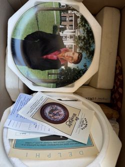 "Remembering Elvis" series by The Bradford Exchange, featuring artwork by Nate Giorgio with a gold rim and certificate of authenticity. Lot of 7 colle