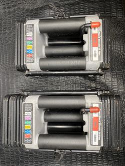 Powerblocks dumbbells pair one is 25lbs another one is 45lbs both extendable up to 70lbs