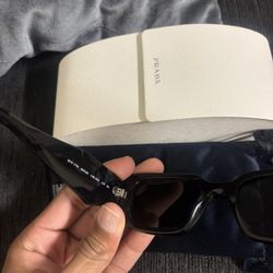 Prada Symbol Glasses .