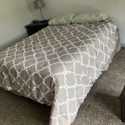 Queen Bed with frame, mattress, and bedding