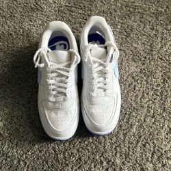 White n blue Nike shoes