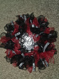 chucky wreath with white spiderweb patterns
