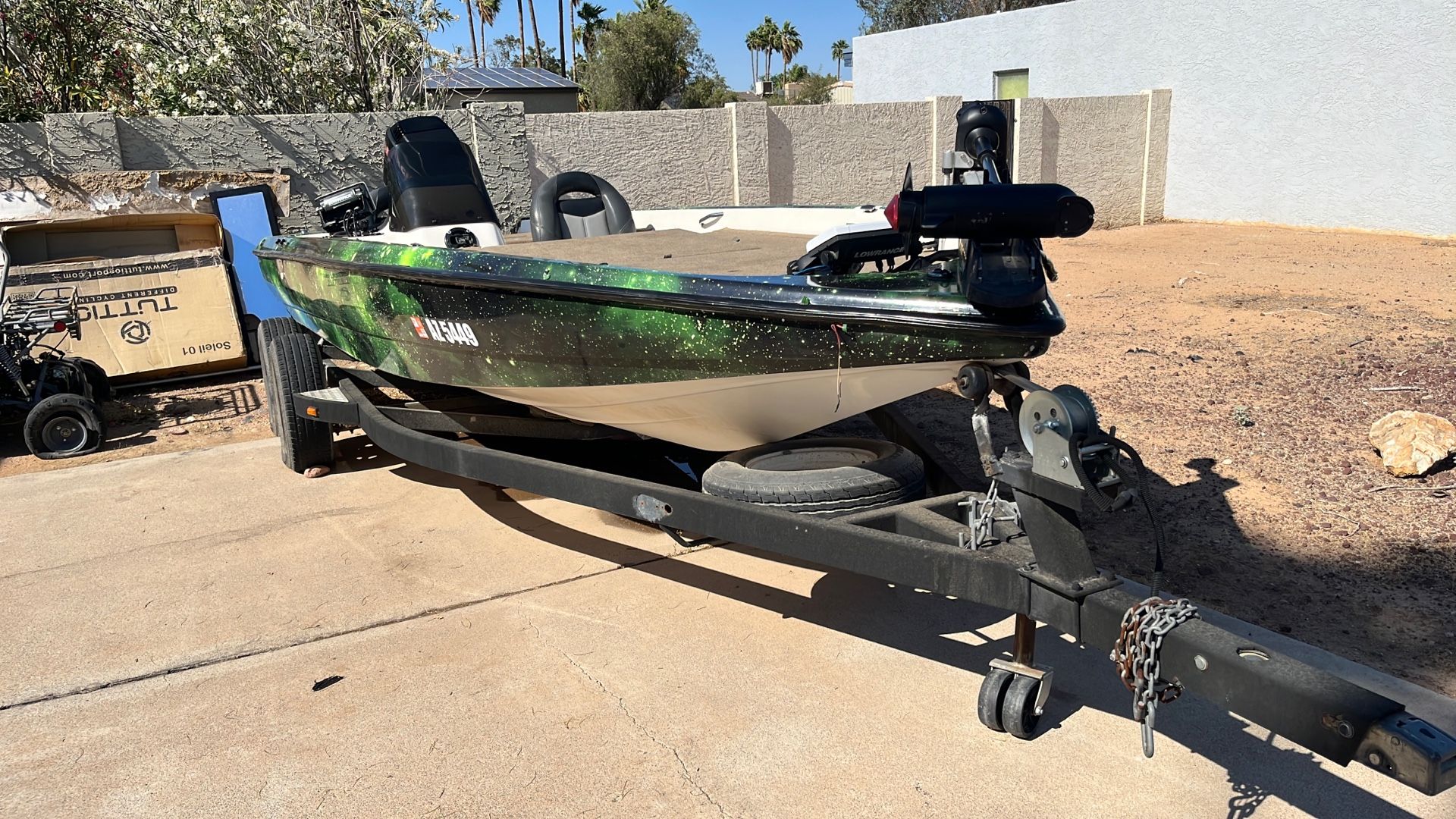 1994 Tracker Bass Boat With Green Galaxy Wrap.