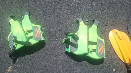 Large Life Vests/ Paddles