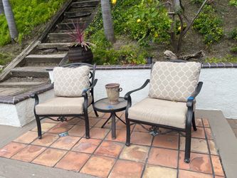 2 wrought iron chairs