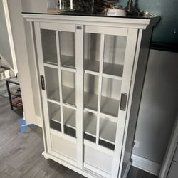 White Wooden Cabinet With Display Sliding Doors