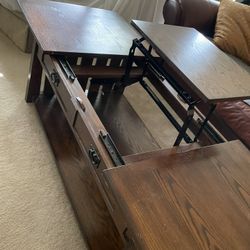 For pick up in Wintergarden Florida, sturdy quality shaker style coffee table with smooth opening that reveals a work area table that lifts up has a b