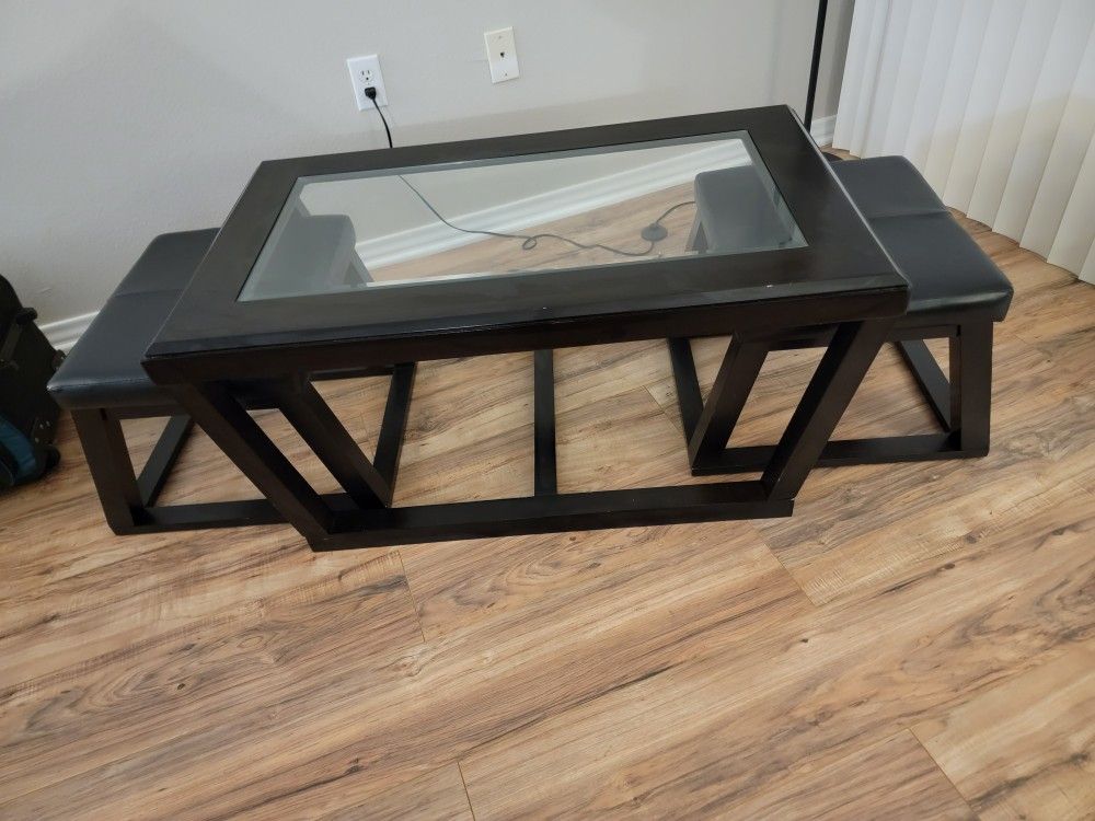 3-Piece Coffee Table. Dark Brown/Black Center Table With Glass Top, and Two Side Tables With Black Leather Top.
