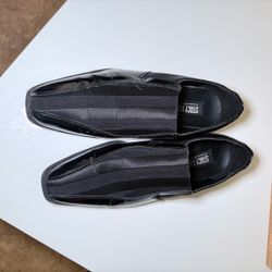 These are black Stacy Adams formal slip-on shoes, distinguished by their elegant satin panels featuring a striped design on the upper.