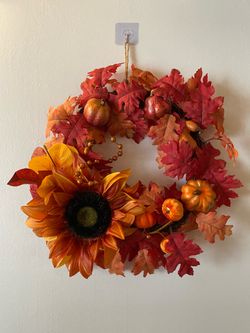 Homemade orange and red autumn/harvest wreath