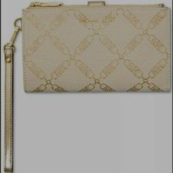 Brand new with tags michael kors wallet and wristlet.