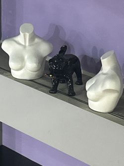 Porcelain pugs and mannequin torso