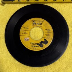 This item is a vintage 7-inch vinyl record, specifically a 45 RPM single titled "Make Me Lose My Mind" by The Nutmegs, released on the Herald label. 