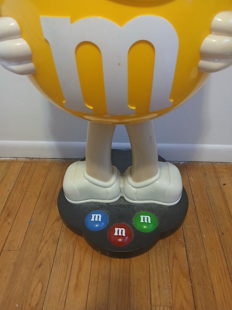 Giant Yellow M&M Display On Wheels