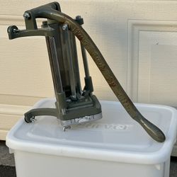 This is a robust, cast iron, lever-operated French Fry Cutter 