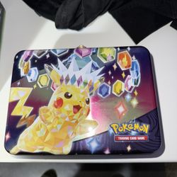 Pokemon Surging Sparks Tin