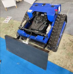 REMOTE CONTROLED LAWN MOWER WITH SNOW SHOVEL
