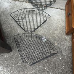 Three black wire corner baskets