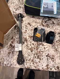 Electric car charger and wall attachment