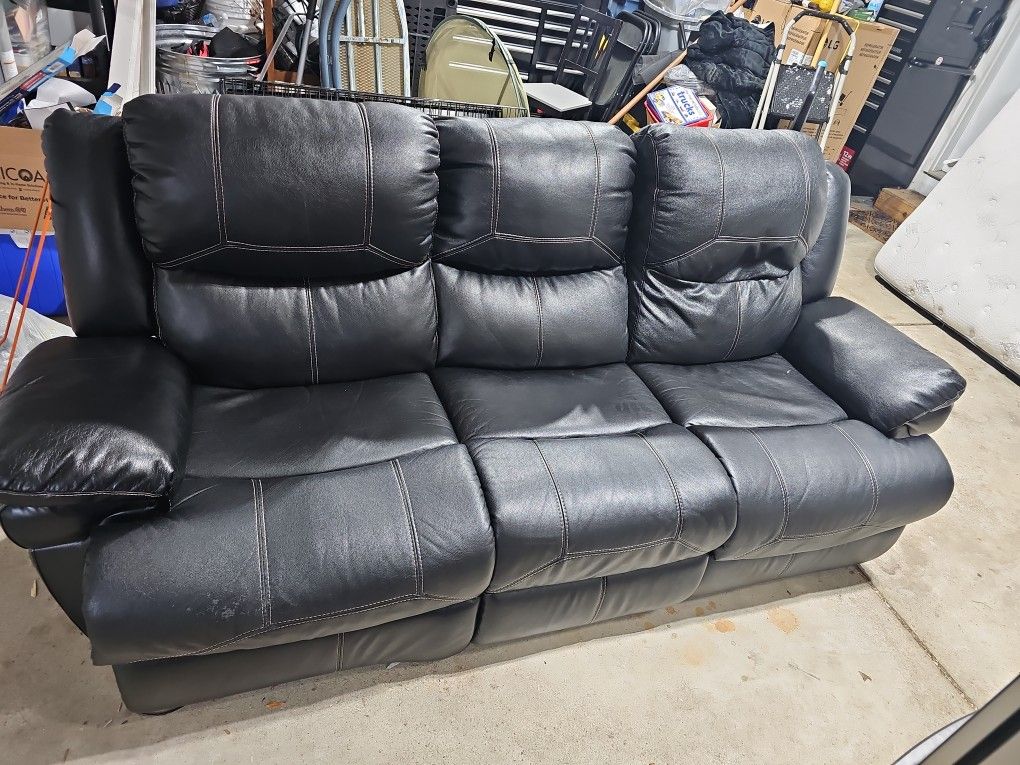 Black Leather Sofa. Electric Recliner And Headrest