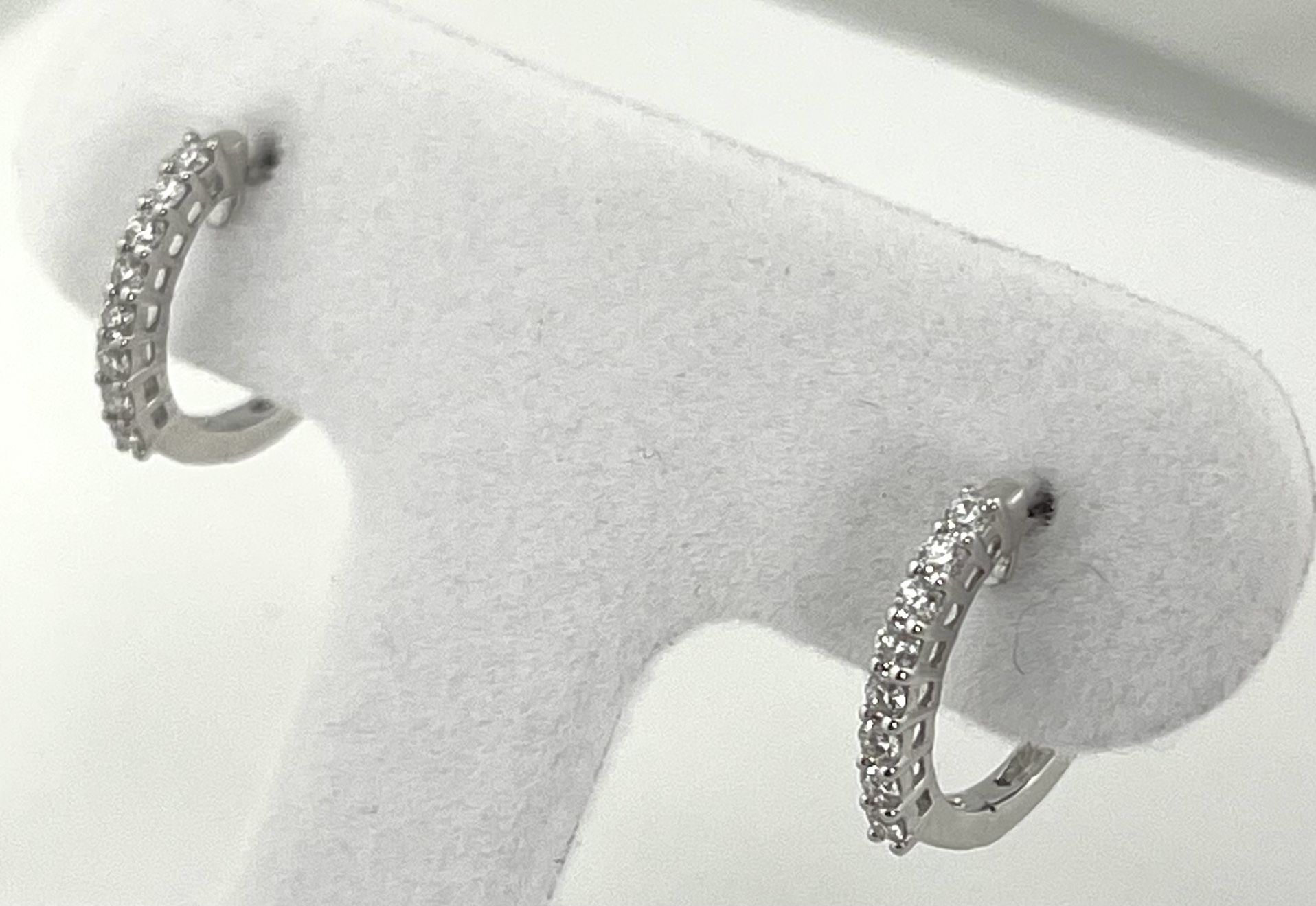 14 K White Gold Huggies’ Earrings. 0.23 Carat Diamond 