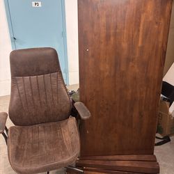 Office desk with two large drawers and a suede/faux leather chair