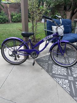 Purple  beach cruiser with gears
