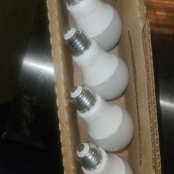 4 Pack Amazon Basics light bulbs. LED 120V 69Hz 809 lumens