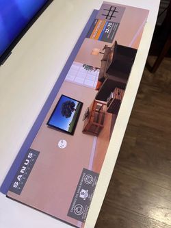 Low-profile wall mount; fits most 32"–70" flat-panel TVs.