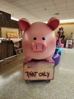 A Pink TivoliToo Pig Display Sculpture With Art Cart