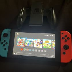 Nintendo Switch V1 Unpatched (Red/Blue Joy-Cons) + Grip — Great Condition