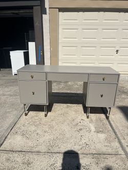 Large gray desk With filing cabinet