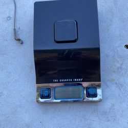 Sharper image digital scale. Both grams in ounces.