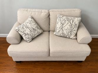 Beige Loveseat with Throw Pillows