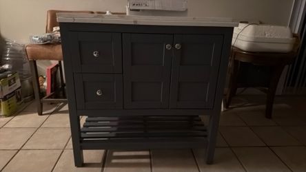 Bathroom sink, vanity, grey blue looking ankle condition